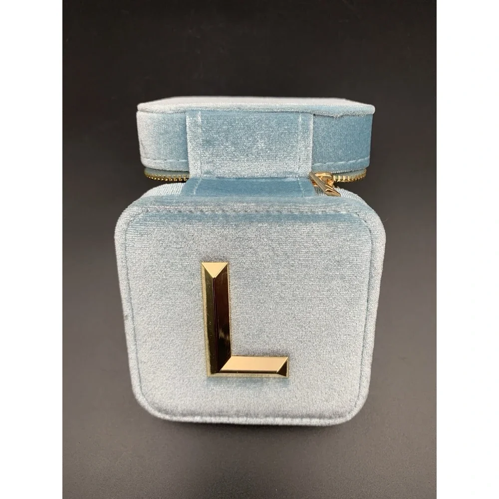 Small blue velvet jewelry box with a zipper